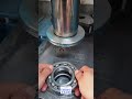 Precision alignment of a ball bearing into its housing using a hydraulic press
