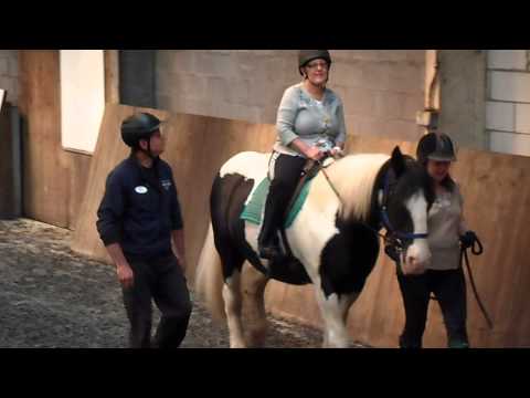 Kym riding in stables