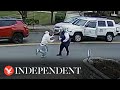 Moment good samaritan shoves suspected thief running from police
