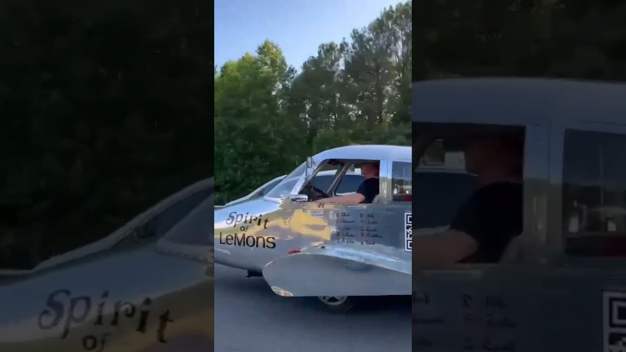 An aeroplane type car driving on road 