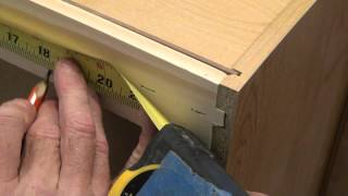 Watch as a cabinet filler strip is added to a cabinet face and then fastened to the wall and adjoining cabinetry. Mounting or ...