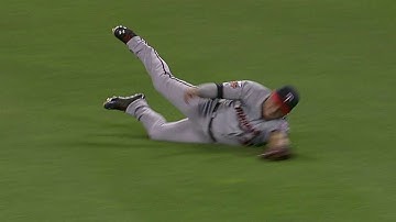 Arcia runs a long way to make a sliding grab