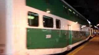 Utdc bi-level series 4 car, 238, leads its fellow cars and gmdd
f59ph-iii locomotive, 560, out of union station.