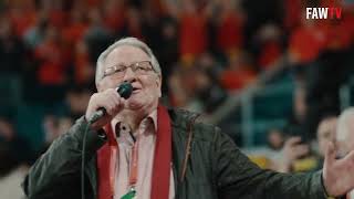 Video thumbnail of "Dafydd Iwan performs 'Yma o Hyd' in front of The Red Wall at the Cardiff City Stadium."
