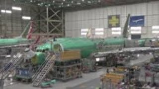 Virus impact forcing massive job cuts at Boeing