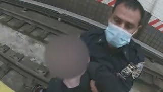Video: NYPD officers rescue woman who fell onto subway tracks