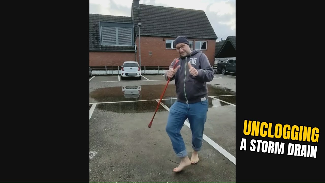 #013-2 Unclogging a storm drain after rain on a parking lot in Germany ...