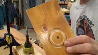 225. Installing new door knobs in an older door.