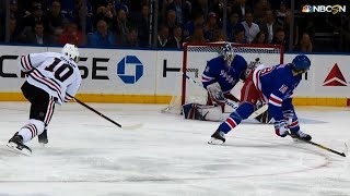 Patrick Sharp nails the bullseye over shoulder of Henrik Lundqvist Information