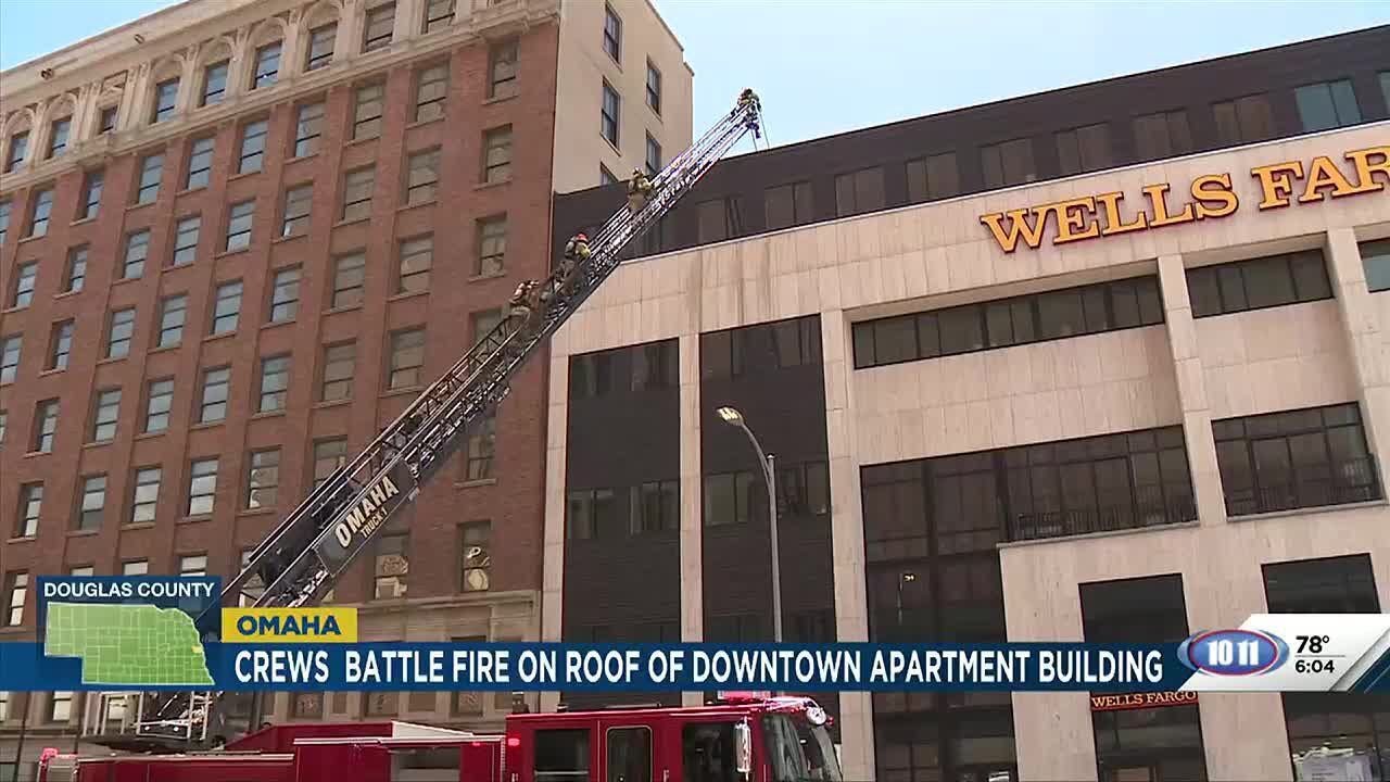 Omaha fire crews fight roof blaze at downtown apartment complex