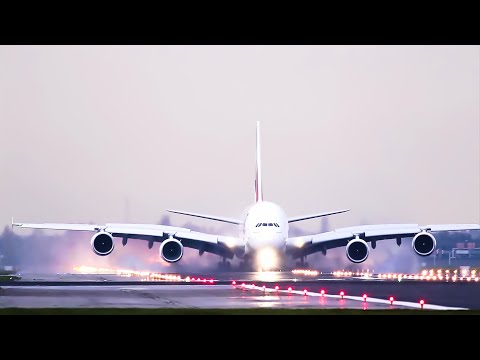A380 Emirates, powerful Reverse thrust on a wet runway.