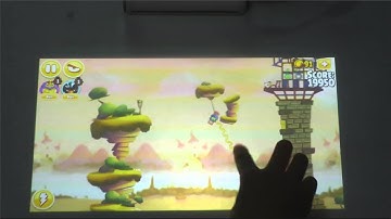 lazertouch mini projector play games by finger