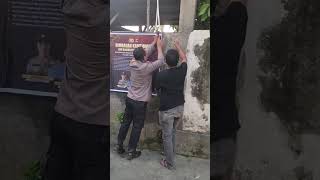 Installation of a banner warning of drug-free status at the Labuapi Police Station