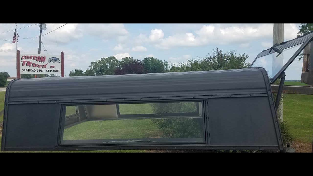 Used cab high aluminum truck cap for mini truck 61x75 painted black. Older but still good unit