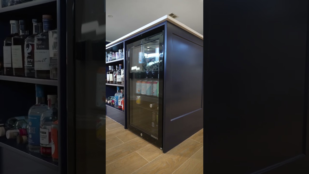 Check out this hidden bar fridge tucked under a massive island benchtop