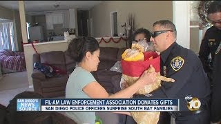 San Diego police officers surprise South Bay families with gift baskets, toys