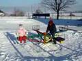 James &amp; Angela on merry-go-round in the snow