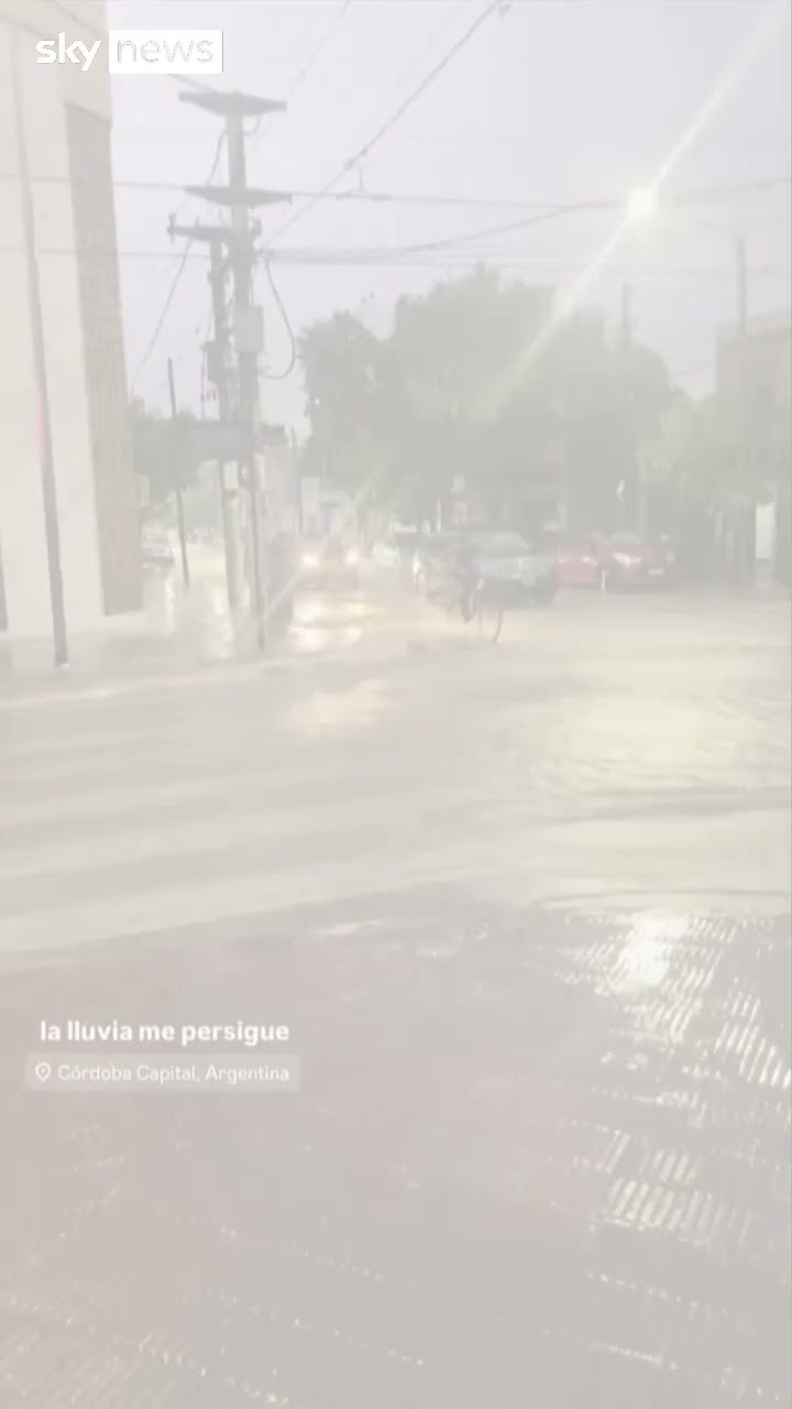 Man bikes through heavy flood waters
