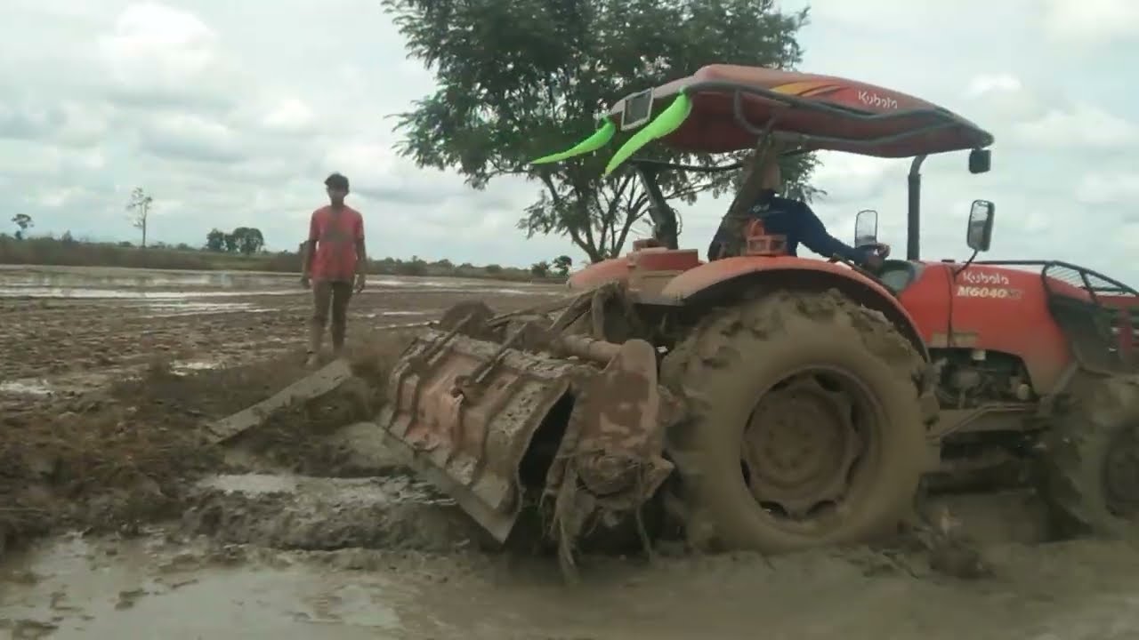 Heavy Duty Farming: Tractor Tilling Muddy Rice Fields!