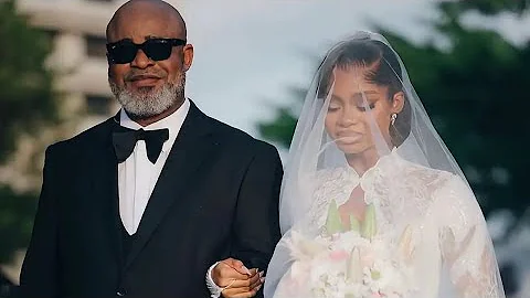 PRISCILLA’sFATHER WALKS HER DOWN THE AISLE AT HER WHITE WEDDING CEREMONY