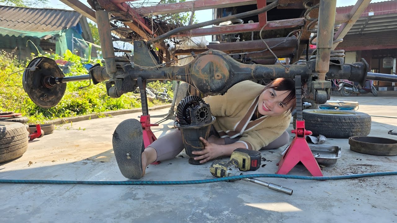 The girl repairs and restores farm vehicles for her neighbor.