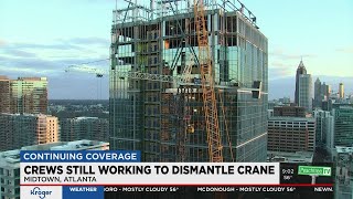 Crews still working to dismantle crane