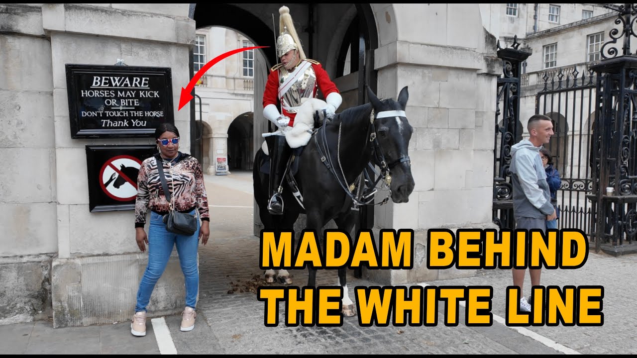 The first warning was ignored. The guard shouts louder: “Back behind the white line!”