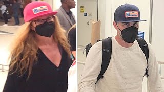 Connie Britton And Beau David E. Windsor Don Matching Caps At LAX