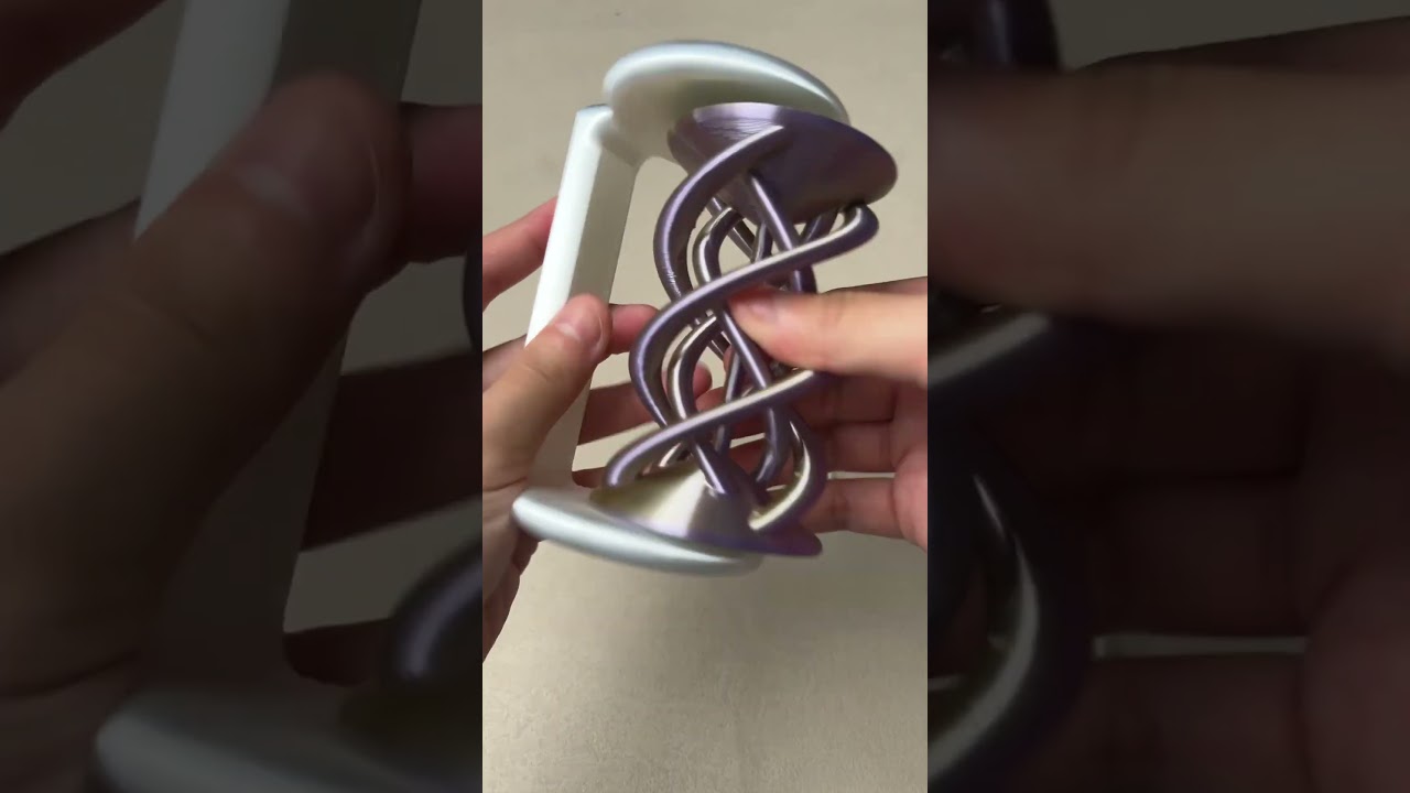 3D-printed Twister Spinning Helix Optical Illusion toy 