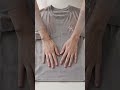 Demonstrate how to fold a T-shirt in 10 seconds #Shorts