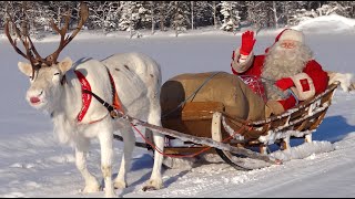 Reindeer ride \& departure of Santa Claus in Rovaniemi Lapland Finland - home of Father Christmas