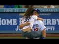 Sarah shahi excitedly leaps into tim federowiczs arms after first pitch