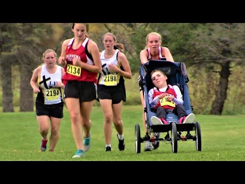 14-year-old cross country runner pushes her big brother in a wheelchair so they can compete together