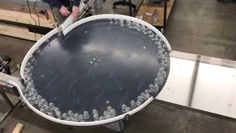 HyTek Automation Solutions - 60" accumulation table - 3 conveyor inlets - 50ml vials