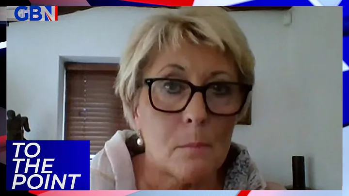 Social Media Campaigner June Slater reacts as a qu...