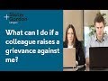 What can I do if a colleague raises a grievance against me?