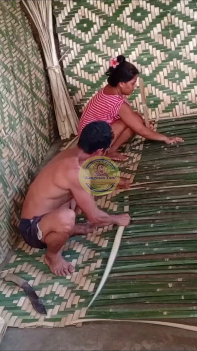 Husband and wife makers of woven bamboo walls