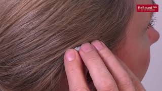 How to turn on/off and put on/take off Behind-the-Ear hearing aids that have an earmould
