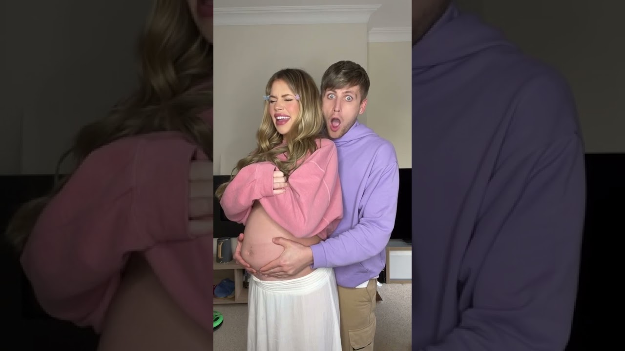 Lifting Her Bump To See How It Feels 