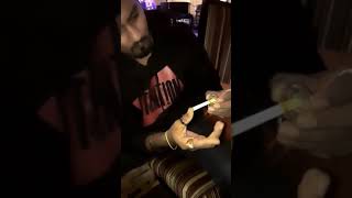Cigarette thru coin