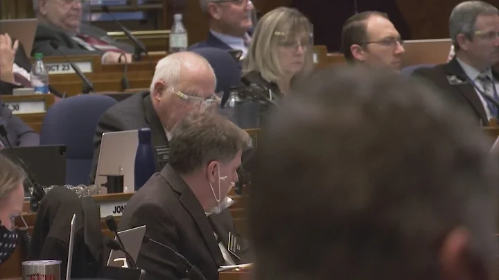 Senators Tracy Potter and Joan Heckaman with over-...