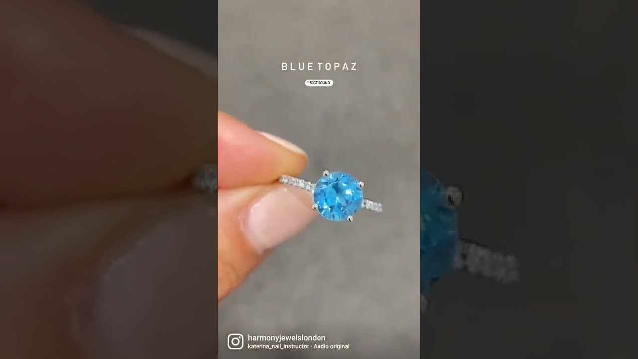 Check out this beautiful bespoke ring blue topaz round centre stone with diamond shoulders