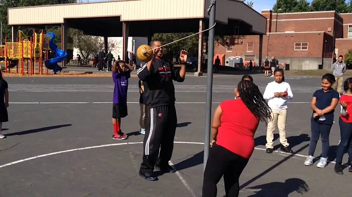 CJ McCollum plays tetherball with kids at Boise-Eliot School