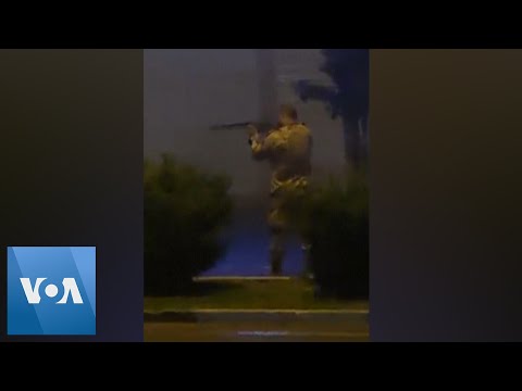 Man in Uniform Fires Rifle Amid Iranian Protests