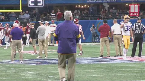 LSU's Steve Ensminger walks sidelines at Peach Bow...