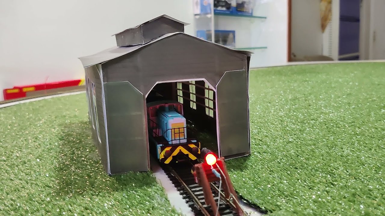 Oxford Rail Janus shunter 0-6-0 pulling Clerestory coaches on my layout with model HO loco shed.