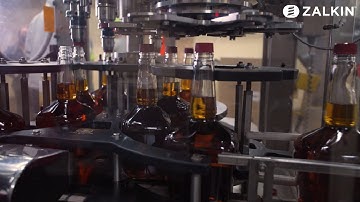 Distilled spirits screw on capper at 10,000 bottles per hour