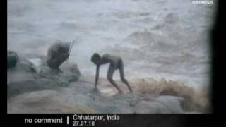 Fishermen stranded by raging flood waters in India - no comment