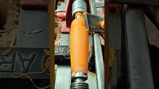 Lathe spins, blade carves, cylinder smooths to shape