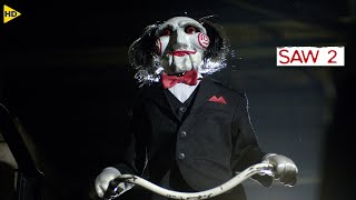 بيجمع الفاسدين ويحبسهم وأكتر شخص فيهم يتخلى عن أجزاء من جسمه هو اللي هينجوا Saw 2